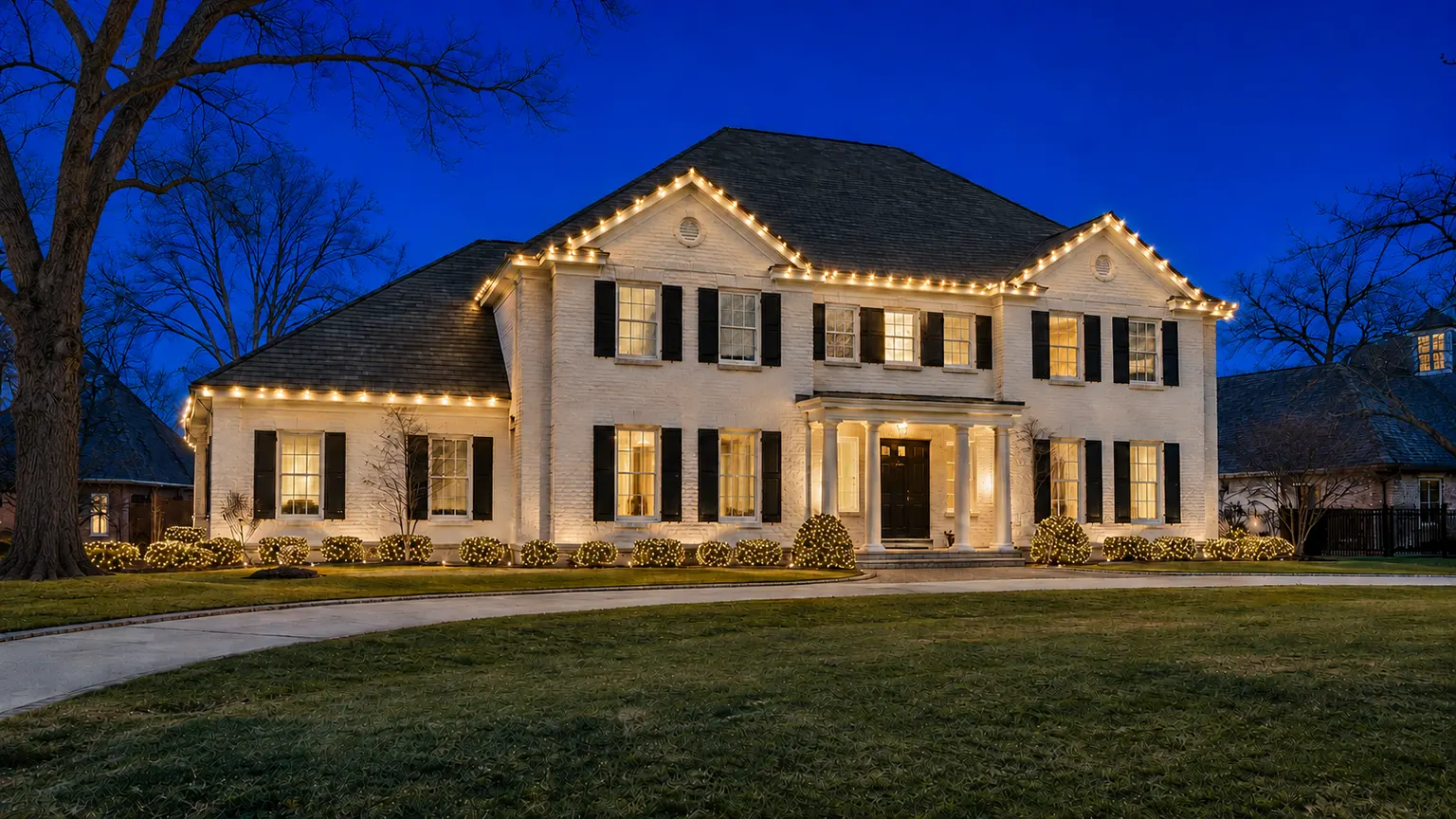 Elegant Christmas lighting on a beautiful Nichols Hills style home